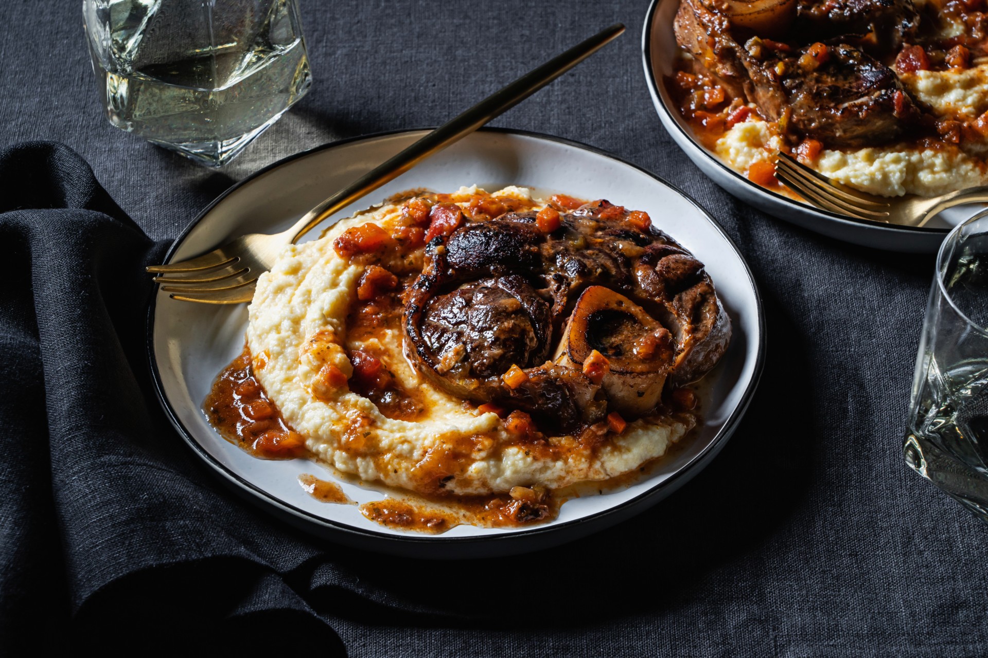 Veal Osso Buco over Polenta on a plate