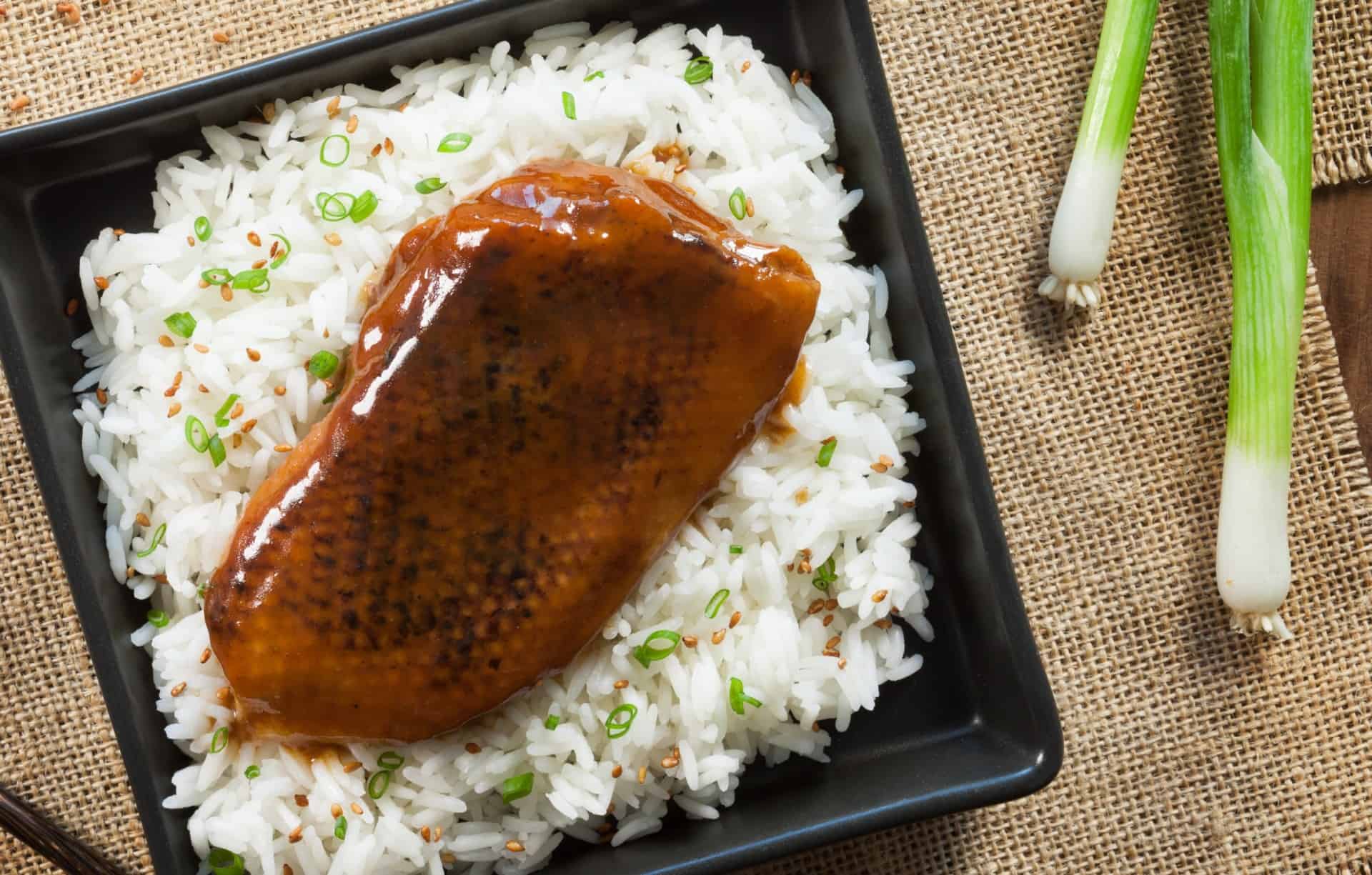char siu duck over rice and green onions