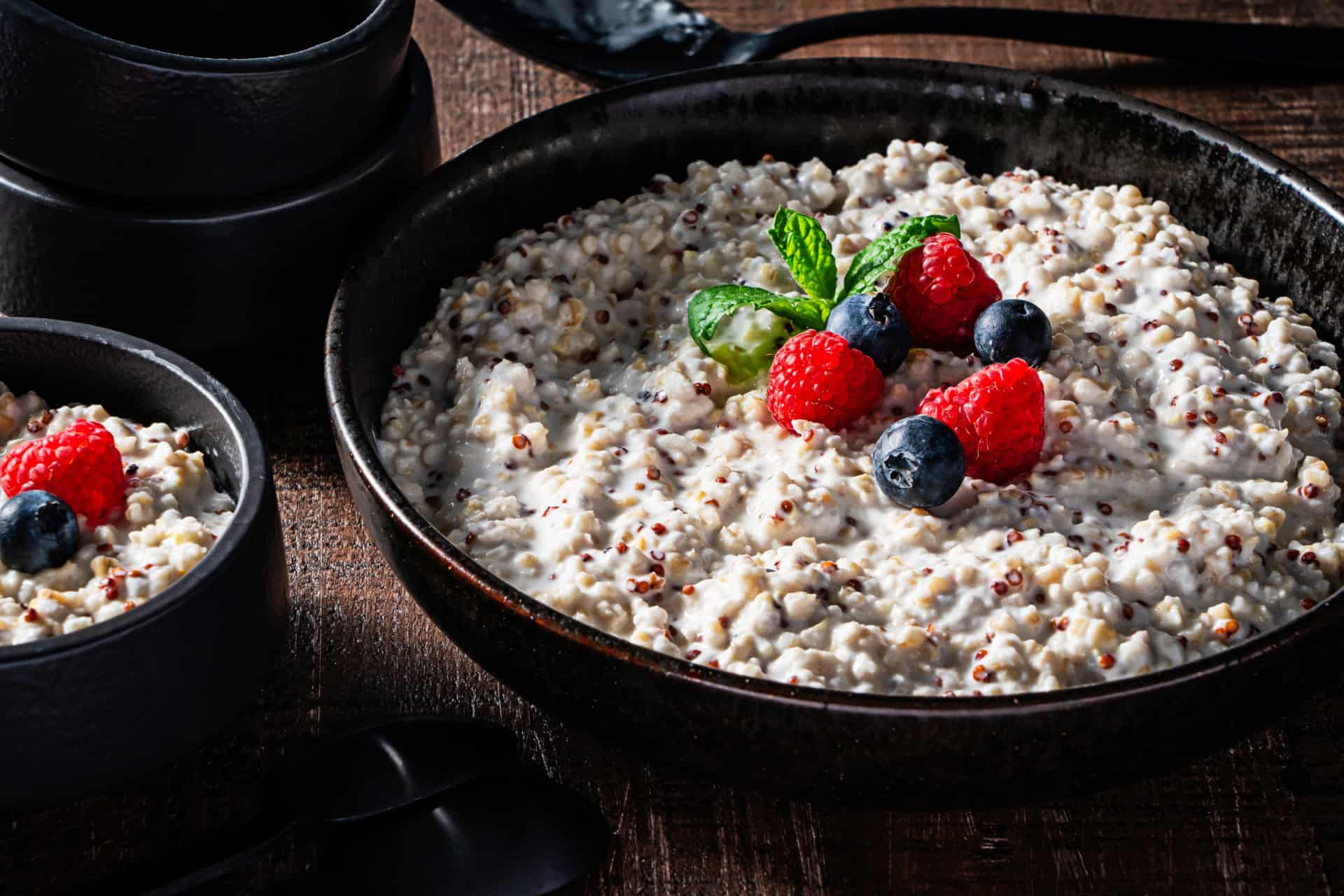 oatmeal and red quinoa in bowl with berries on top