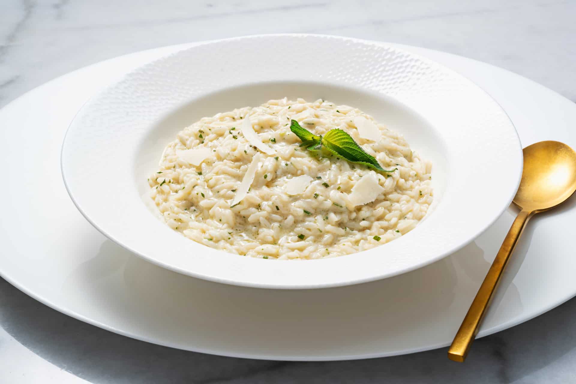 lemon risotto in bowl with green topping